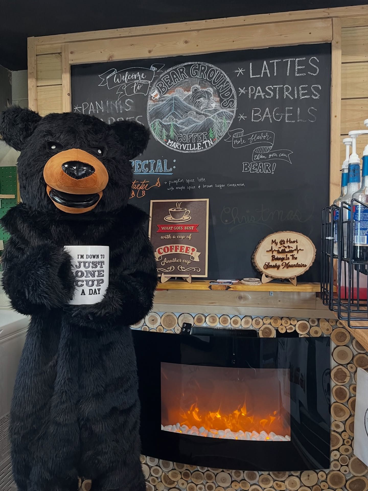 Bear Grounds Coffee chalkboard wall with bear mascot and cozy shop decor